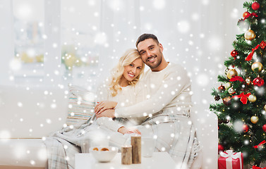 Image showing happy couple at home with christmas tree