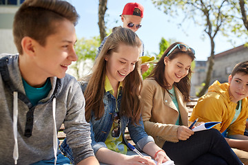 Image showing group of students with notebooks at school yard