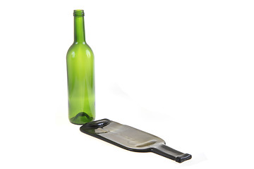 Image showing green glass bottle with one flat bottle