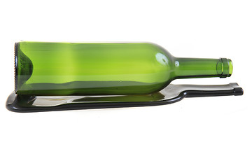 Image showing green glass bottle with one flat bottle