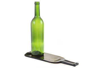 Image showing green glass bottle with one flat bottle