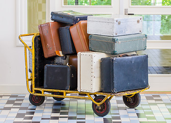 Image showing Trolley full of old luggage