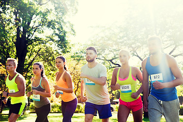 Image showing sportsmen with badge numbers on start of race