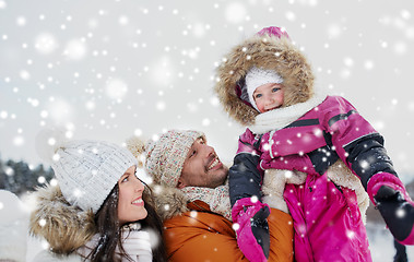 Image showing happy family with child in winter clothes outdoors