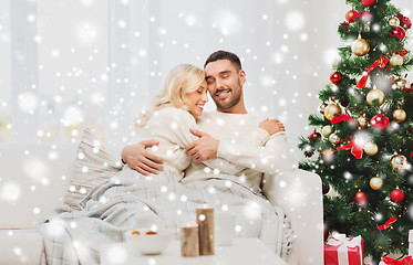 Image showing happy couple at home with christmas tree