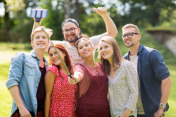 Image showing friends taking selfie by smartphone at summer