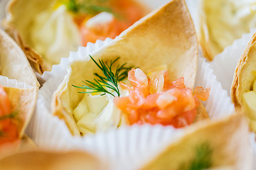 Image showing close up of dough cornet with salmon fish filling