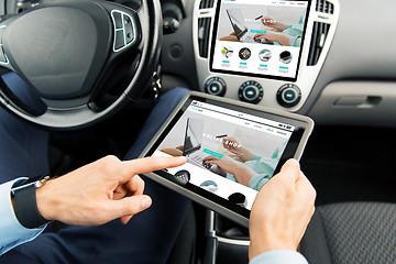 Image showing close up of man with tablet pc in car