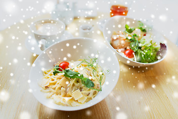 Image showing close up of pasta in bowl on table at restaurant