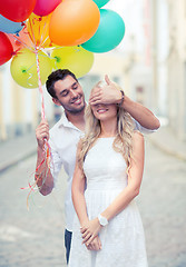 Image showing couple with colorful balloons