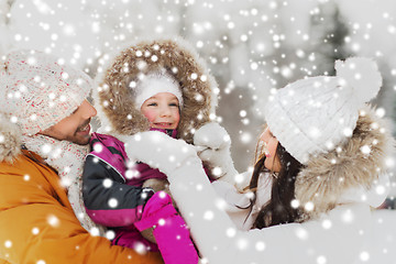 Image showing happy family with child in winter clothes outdoors