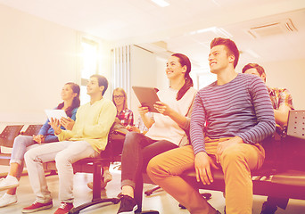 Image showing group of smiling students with tablet pc