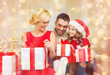 Image showing happy family opening gift boxes