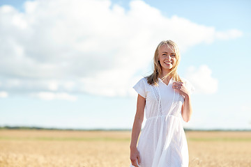 Image showing happy young woman or teenage girl on cereal field