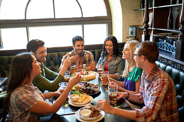 Image showing friends dining and drinking beer at restaurant