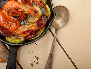 Image showing roasted shrimps with zucchini and tomatoes