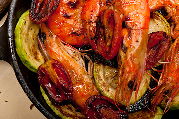 Image showing roasted shrimps with zucchini and tomatoes