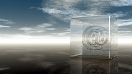 Image showing email symbol in glass cube under cloudy sky - 3d rendering