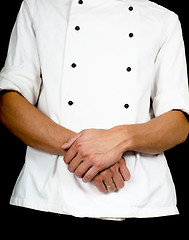 Image showing Professional chef with a hand gesture towards, wearing a chefs j