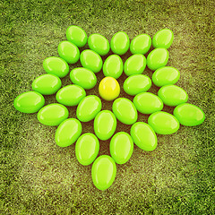 Image showing Colored Easter eggs as a flower on a green grass. 3D illustratio