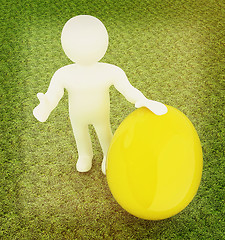 Image showing 3d small person holds the big Easter egg in a hand. 3d image. On