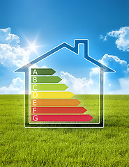 Image showing green house in the sun with energy efficiency graph