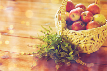 Image showing close up of melissa and basket with apples