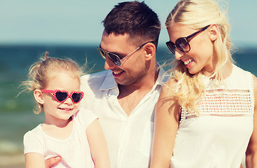 Image showing happy family in sunglasses on summer beach