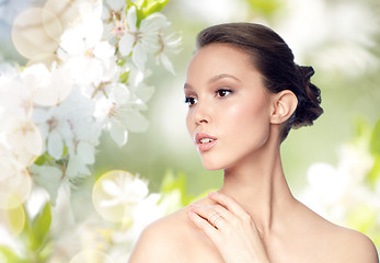 Image showing face of beautiful asian woman with golden ring