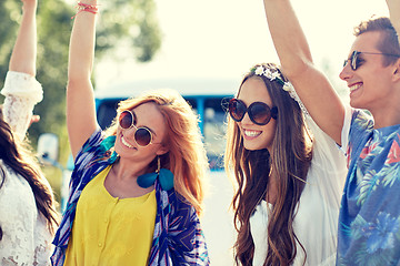 Image showing happy young hippie friends dancing outdoors