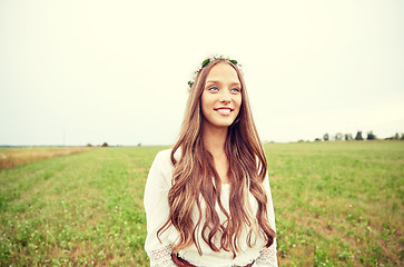 Image showing smiling young hippie woman on cereal field