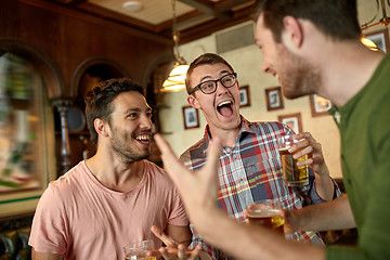 Image showing football fans or friends with beer at sport bar