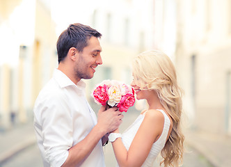 Image showing couple with flowers in the city