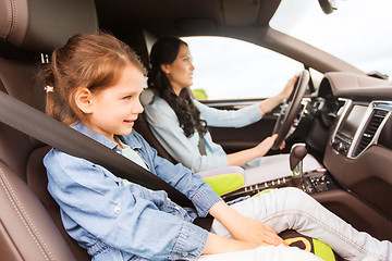 Image showing happy woman with little child driving in car