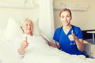 Image showing nurse and senior woman showing thumbs up at clinic