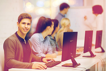 Image showing students with computer monitor at school