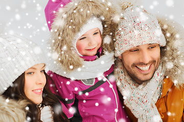 Image showing happy family with child in winter clothes outdoors