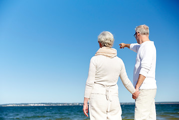 Image showing happy senior couple on summer beach