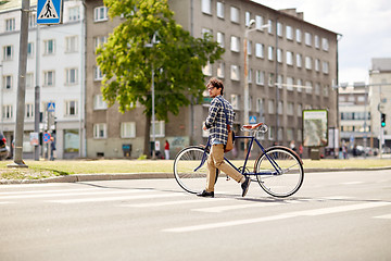 Image showing young man with fixed gear bicycle on crosswalk