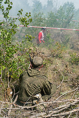 Image showing Athletes run on a ravine in extrim race. Tyumen