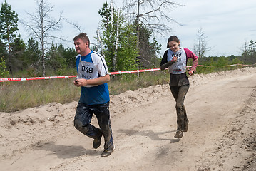 Image showing Athletes run between stages in extrim race.Tyumen