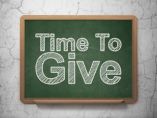 Image showing Time concept: Time To Give on chalkboard background