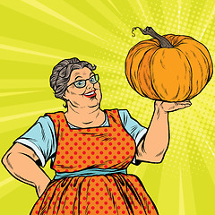 Image showing Cheerful grandmother with pumpkin for Thanksgiving