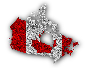Image showing Map and flag of Canada on poppy seeds