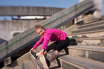 Image showing woman  stretching before morning jogging