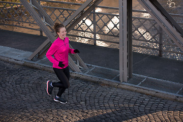 Image showing sporty woman jogging on morning