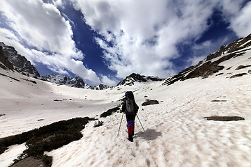 Image showing Hiker in snow mountain at sun day