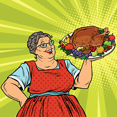 Image showing Grandma with a Christmas or Thanksgiving roast Turkey