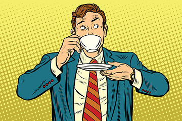 Image showing Businessman drinking Cup of coffee looking sideways