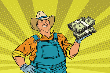 Image showing Rural farmer with bundles of money